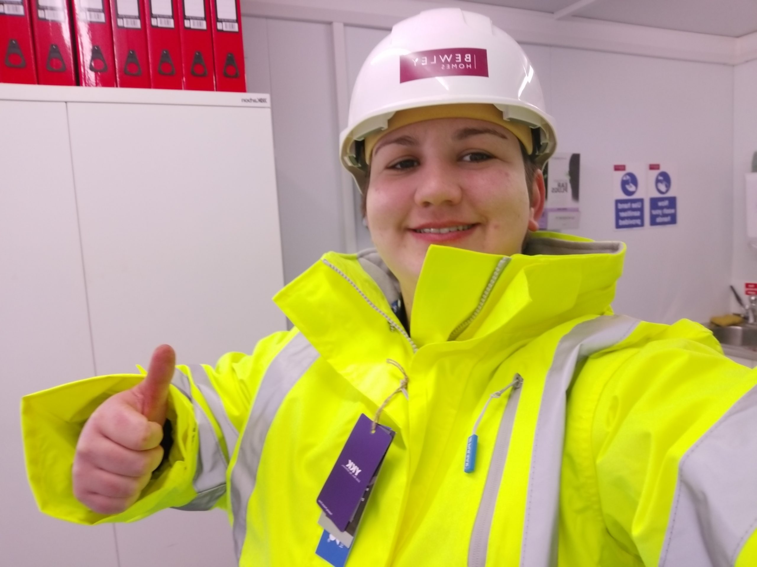 Torie in high vis giving a thumbs up